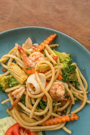 Spaghetti with spicy seafood asian style - street foodの写真素材
