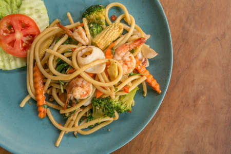 Spaghetti with spicy seafood asian style - street foodの写真素材