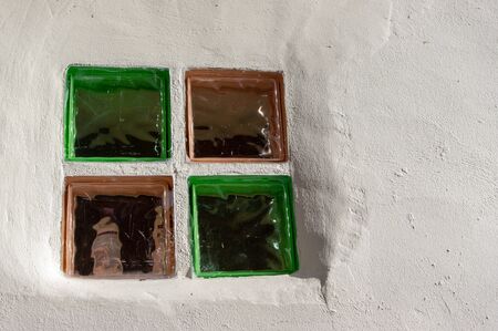 Glass window blocks in white washed wall