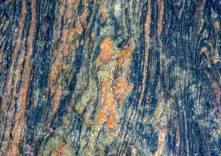 Colourful rough rock surface with marble effect a good backgroung.の写真素材
