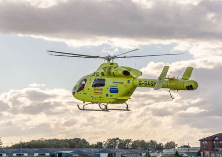Pocklington, East Yorkshire, UK, 08/26/2015 - The Yorkshire Air Ambulance taking off from Pocklington Airfield.のeditorial素材