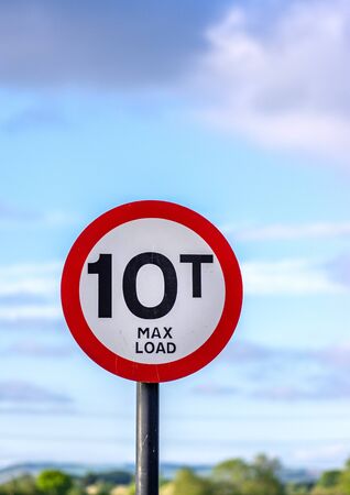 Round warning sign with a 10 ton maximum weight limit for road vehicles.の写真素材