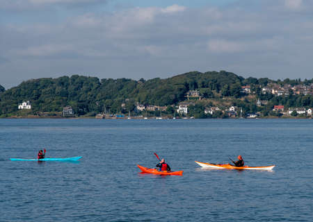 South Queensferry, Edinburgh, Scotland 7th September 2021 - Three  Kayaks on the River Forth at Queensferry on a sunny day with clear sky.のeditorial素材