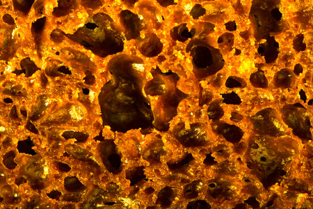 golden sponge, foamed gold surface, foaming gold, texture. taken in close-up