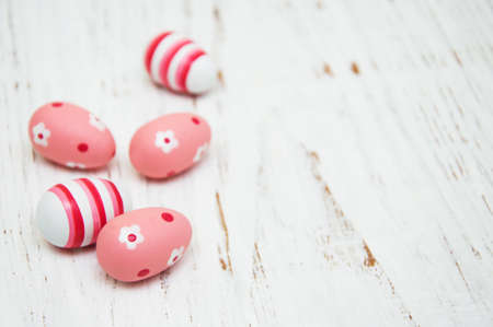Easter eggs  on the old white wooden backgroundの写真素材