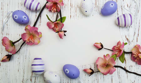 easter background with easter eggs and flowers