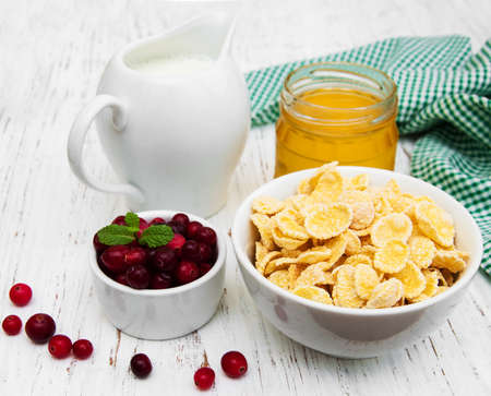Cornflakes with milk, honey and fresh cranberries