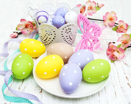 easter table setting, easter eggs, candles and blossomの写真素材