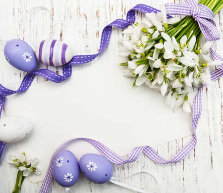 Easter background with snowdrops, eggs and ribbonの写真素材