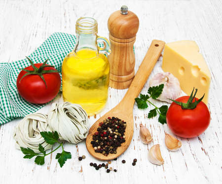 italain  ingredients on a old wooden backgroundの写真素材