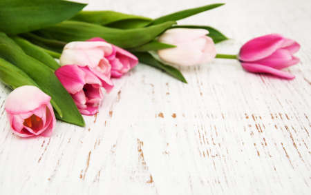 bouquet of pink tulips  on a wooden backgroundの写真素材