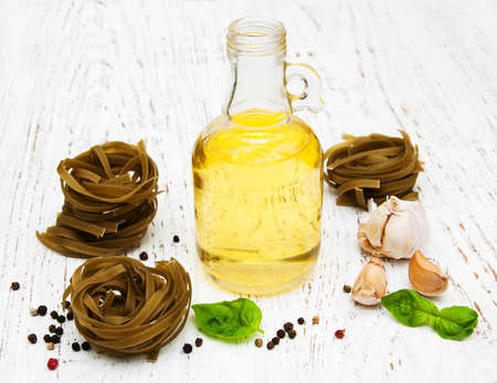 spaghetti, olive oil  and others ingrdients for italian pastaの写真素材