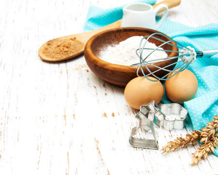 Baking ingredients on a old wooden background