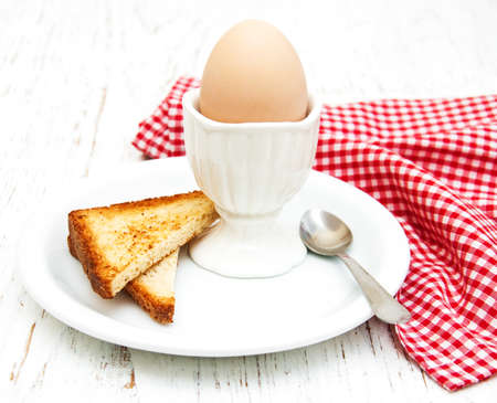 boiled eggs for breakfast on a old wooden tableの写真素材