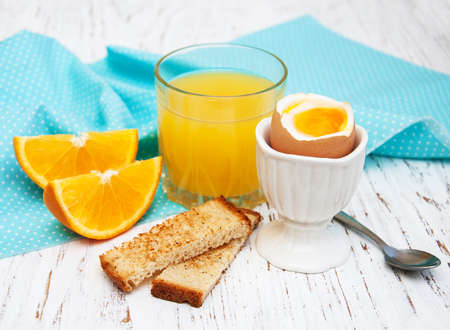 boiled eggs for breakfast on a old wooden tableの写真素材