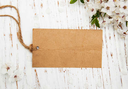 spring cherry blossom with card on a wooden backgroundの写真素材