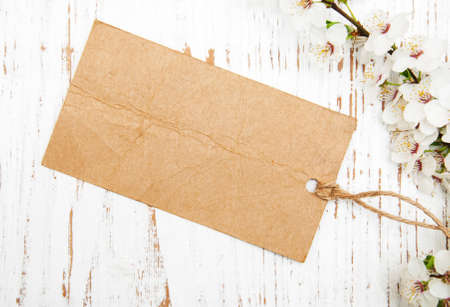 spring cherry blossom with card on a wooden backgroundの写真素材