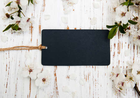 spring cherry blossom with card on a wooden backgroundの写真素材