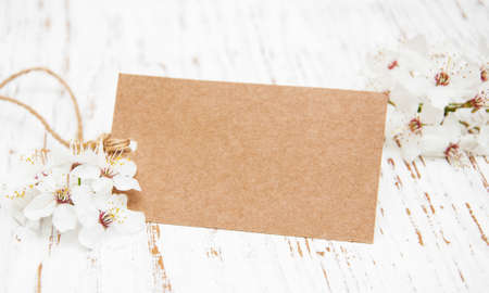 spring cherry blossom with card on a wooden backgroundの写真素材