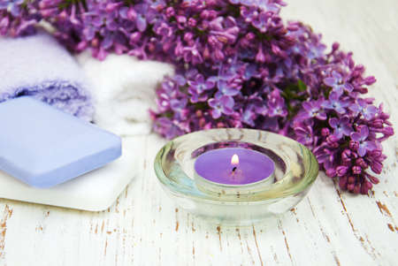 Spa concept - natural soap, towels and lilac flowersの写真素材