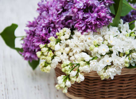 Lilac flowers in a basket - close upの写真素材