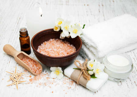 Spa concept with jasmine flowers on a old wooden backgroundの写真素材