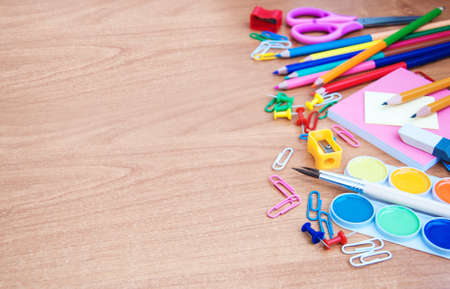 school and office supplies on a wooden tableの写真素材