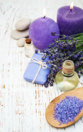 Spa products and lavender flowers on a old wooden backgroundの写真素材
