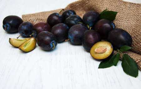 sweet plums on a old wooden backgroundの写真素材
