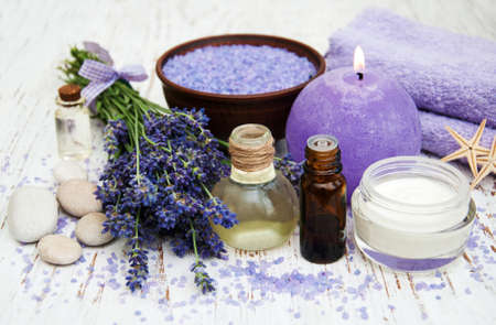 Spa products and lavender flowers on a old woodenの写真素材