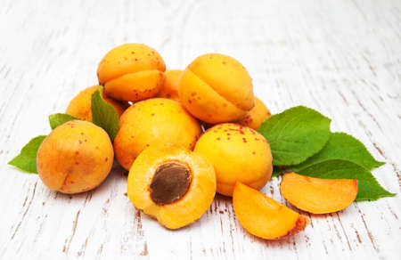 Fresh apricots on a old wooden backgroundの写真素材