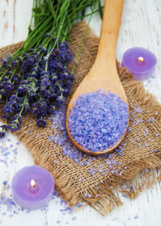Lavender, candle and massage salt on a old wooden backgroundの写真素材