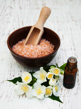 essential oil with jasmine flower on a wooden backgroundの写真素材