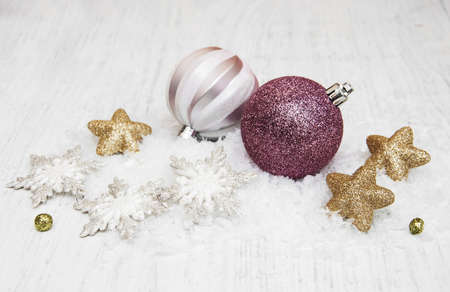 christmas baubles on a old wooden backgroundの写真素材