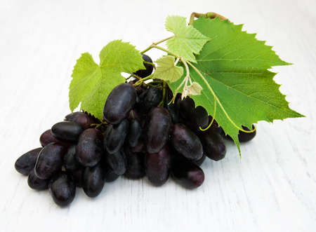 grapes bunch on a old wooden backgroundの写真素材