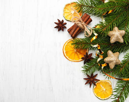 Christmas tree with baubles and dry oranges on a old wooden backgroundの写真素材