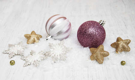 christmas baubles on a old wooden backgroundの写真素材