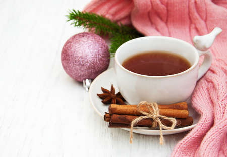 Cup of tea with christmas tree and scarfの写真素材