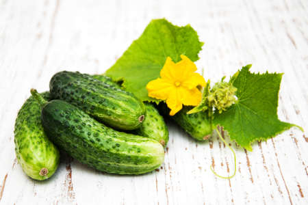 Fresh cucumbers on a old wooden backgroundの写真素材