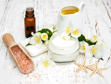 Spa concept with jasmine flowers on a old wooden backgroundの写真素材