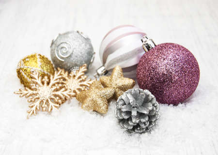 christmas baubles on a old wooden backgroundの写真素材