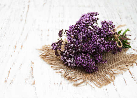 bunch of thyme herb on a old wooden background
