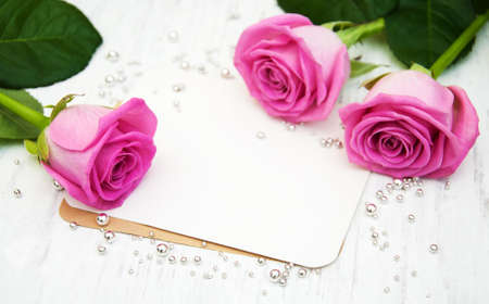 Fresh Pink  roses on a wooden backgroundの写真素材