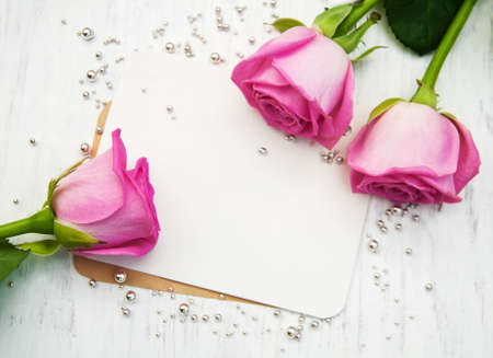 Fresh Pink  roses on a wooden backgroundの写真素材