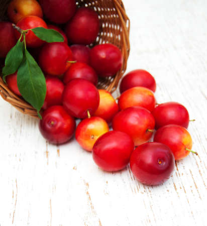 sweet plums on a old wooden backgroundの写真素材