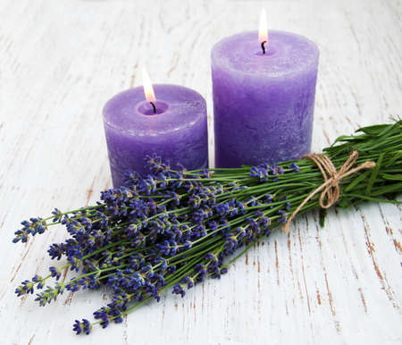 Lavender and  candles  on a wooden backgroundの写真素材
