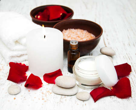 rose flower petals with aromatherapy essential oil glass bottleの写真素材