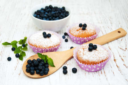 muffins with blueberry on a old wooden backgroundの写真素材