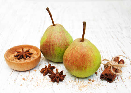 Fresh pears on a old wooden backgroundの写真素材