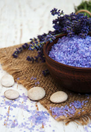 Lavender, sea salt and candle on a wooden backgroundの写真素材
